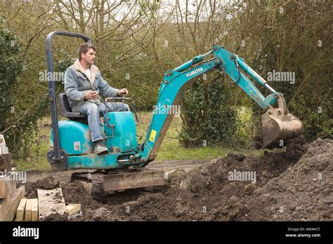 driving a mini digger on the road|operating mini digger beginner.